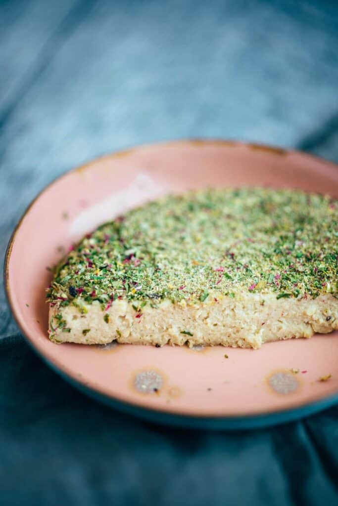 Vegan cheese with herb coating